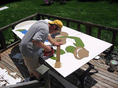 cutting mural design in wood